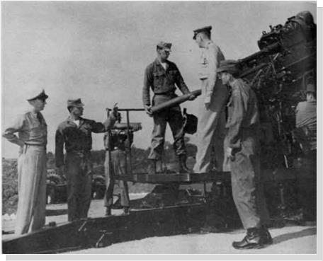 Colonel Galloway is briefed on AAA gun operation by Battery C. 14th AAA